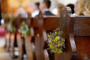 Church pew with flowers